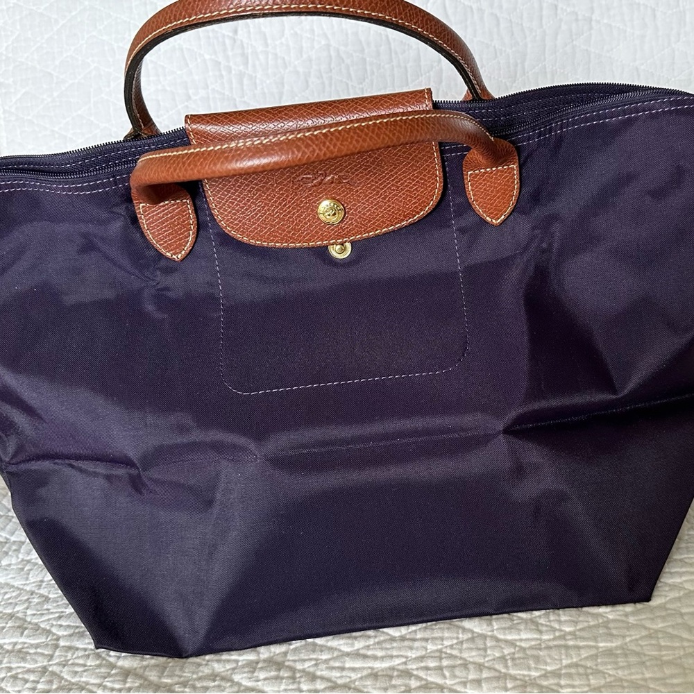 Longchamp Medium nylon tote with short handles.